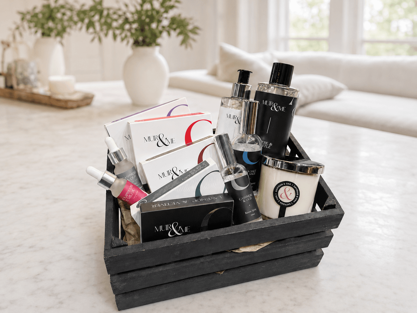 The giveaway hamper: Amber and Myrtle body and hand wash, a Saffron and Oak candle, two pure oil blends, two room sprays and five sets of aroma melts, in a black wooden crate